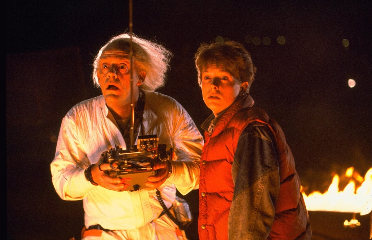 The first Back to the Future film premiered on July 3, 1985, with Christopher Lloyd as Emmett Brown and Michael J. Fox as Marty McFly (Credit: Universal Pictures)