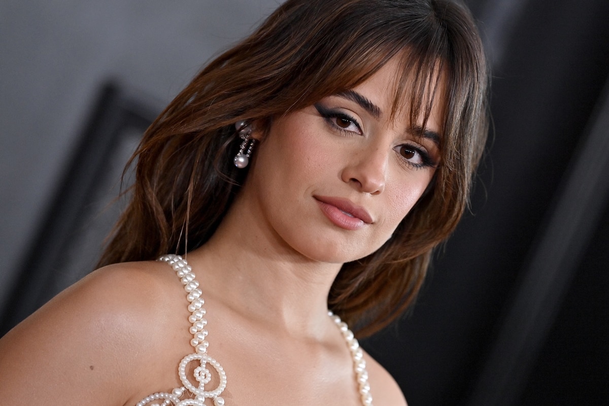 Camila Cabello complemented the outfit with pearl-and-diamond jewelry and her signature front bangs, making her look modern and edgy