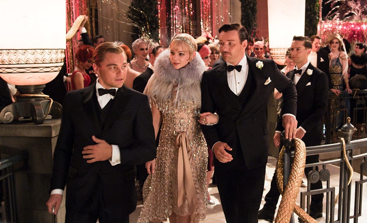 Carey Mulligan wearing a flapper dress with Leonardo DiCaprio and Joel Edgerton on the set of the 2013 historical romantic drama movie The Great Gatsby