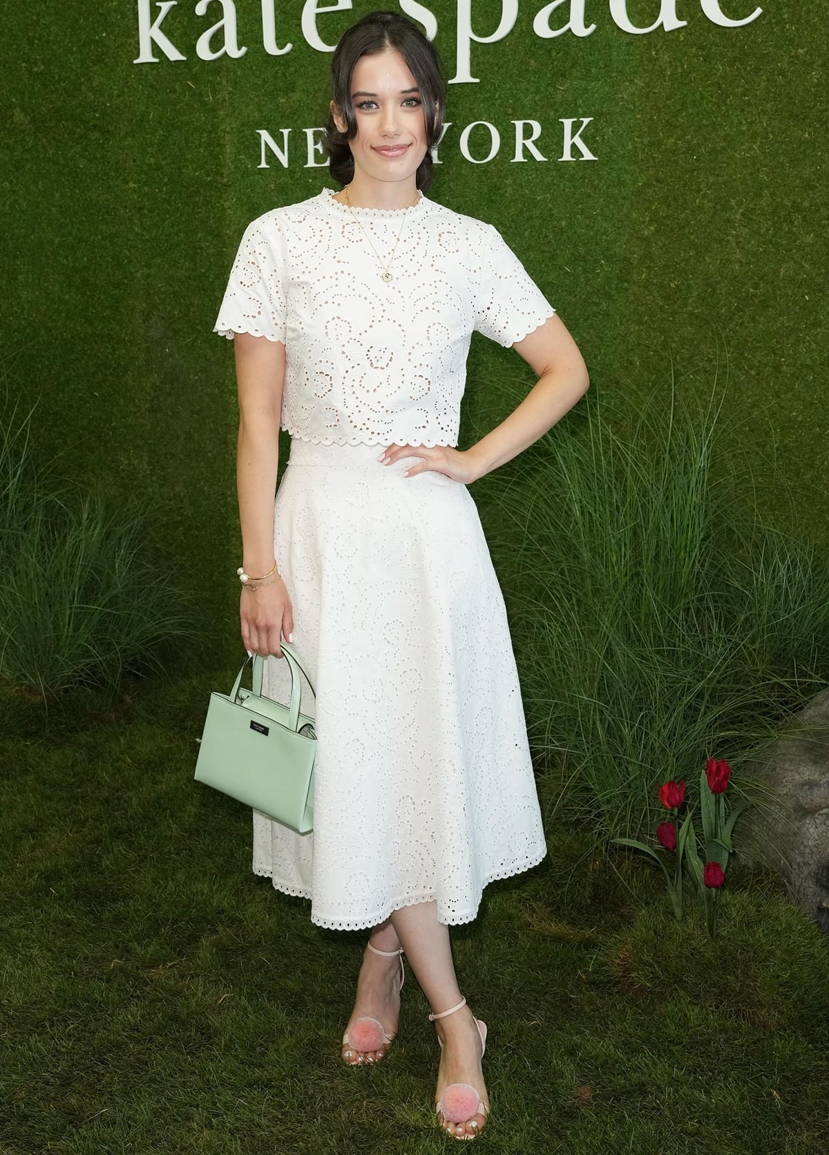 Ella Bleu Travolta in a white dress at the Kate Spade Presentation