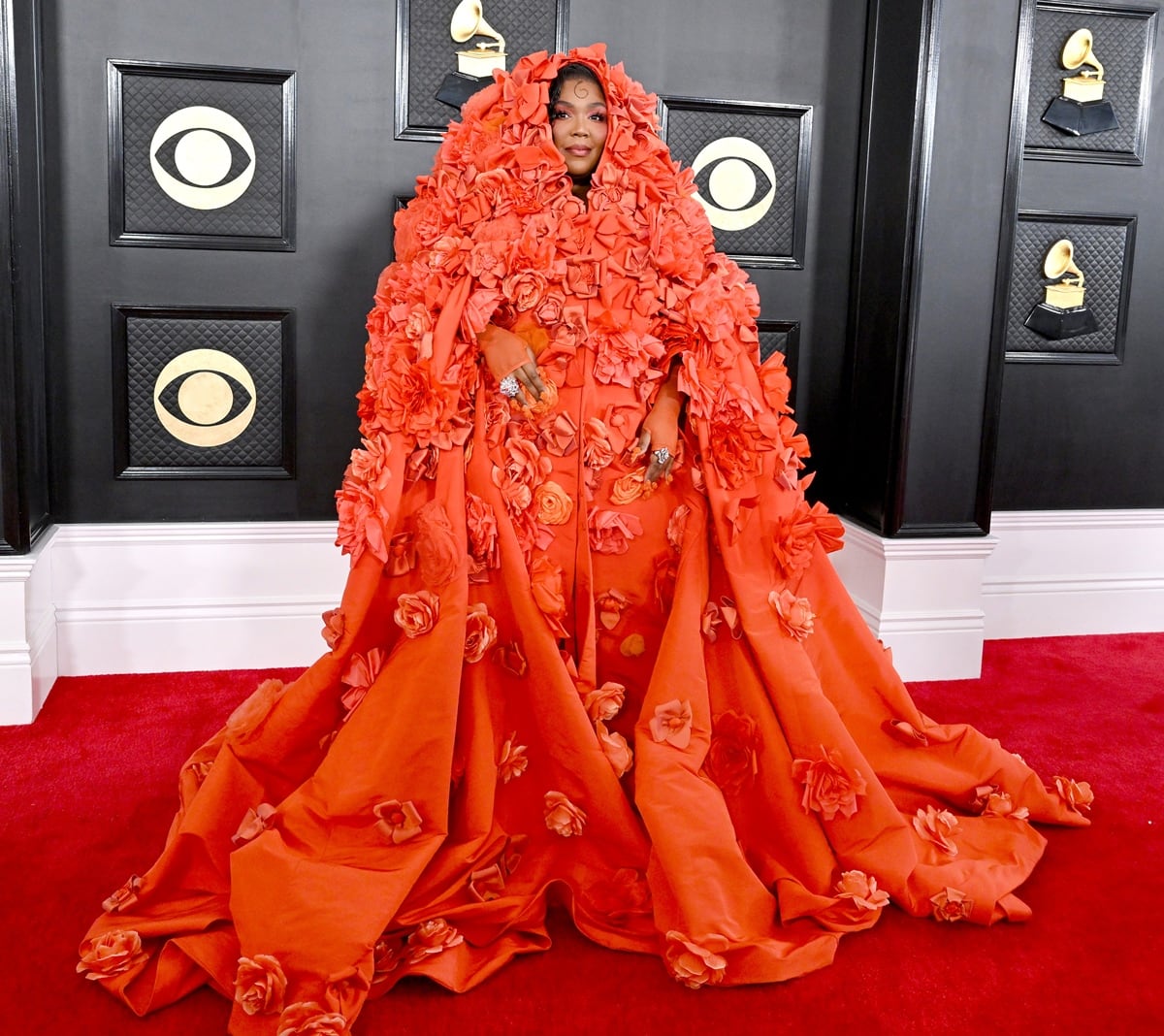 Lizzo turned up to the 65th annual Grammy Awards in an orange Dolce & Gabbana ensemble covered in hand-embroidered silk flowers