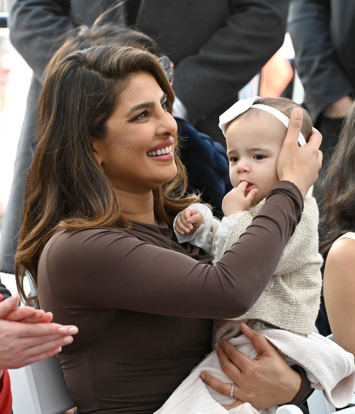 Priyanka Chopra Jonas with daughter Malti Marie at the Hollywood Walk of Fame star ceremony honoring The Jonas Brothers