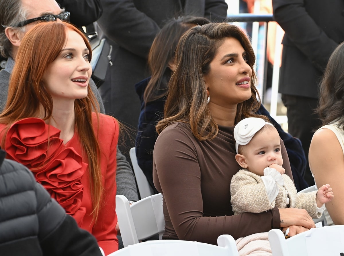 Malti Marie Chopra looked adorable in a woolen cardigan and white hairband while she sat with her mother, Priyanka Chopra, and Sophie Turner during the ceremony