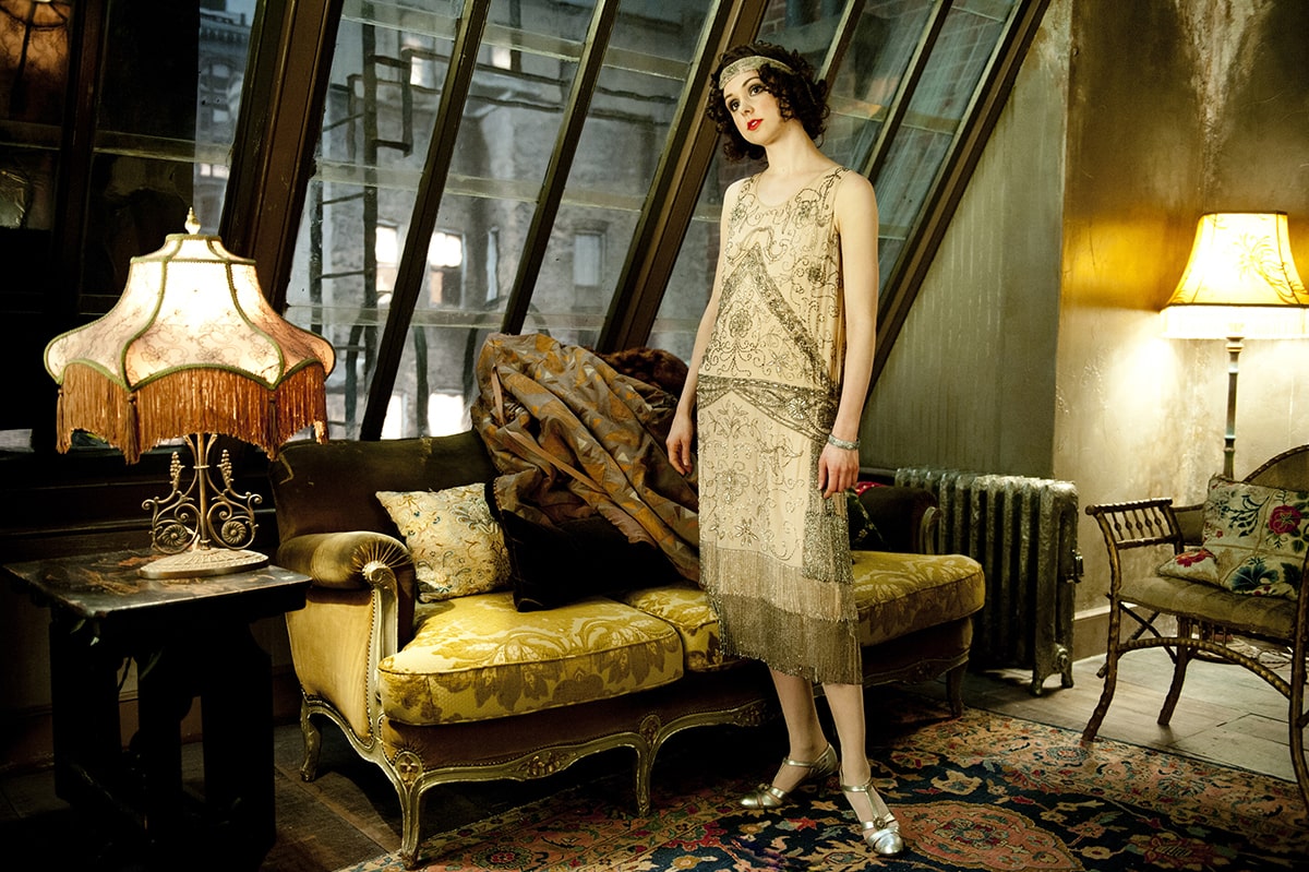 Boardwalk Empire's Meg Chambers Steedle wearing a sleeveless flapper dress with a straight, slip silhouette and fringe and crystal embellishments