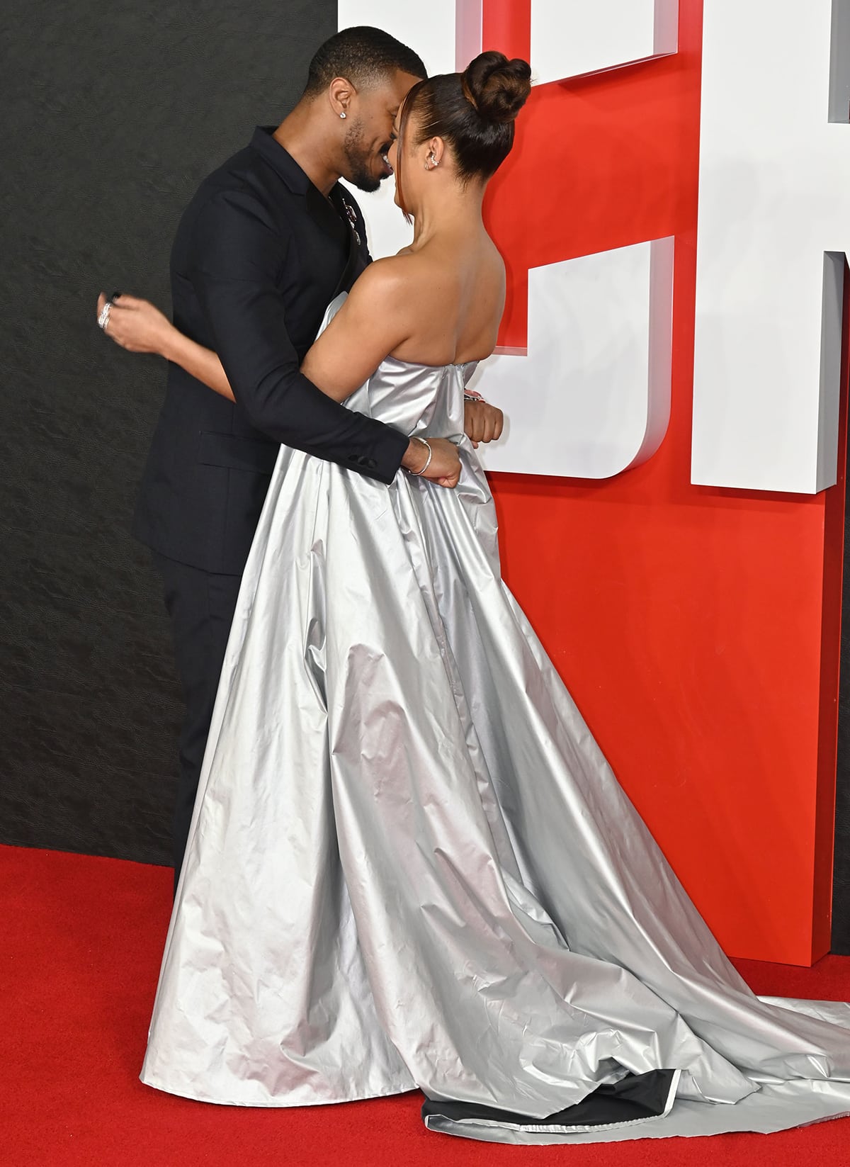 Michael B. Jordan and Tessa Thompson appear to be packing on some PDA on the red carpet