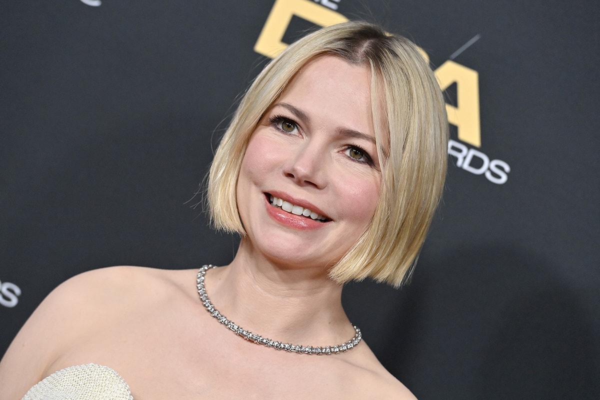 Michelle Williams wears a sophisticated bob hairstyle with minimal soft pink makeup
