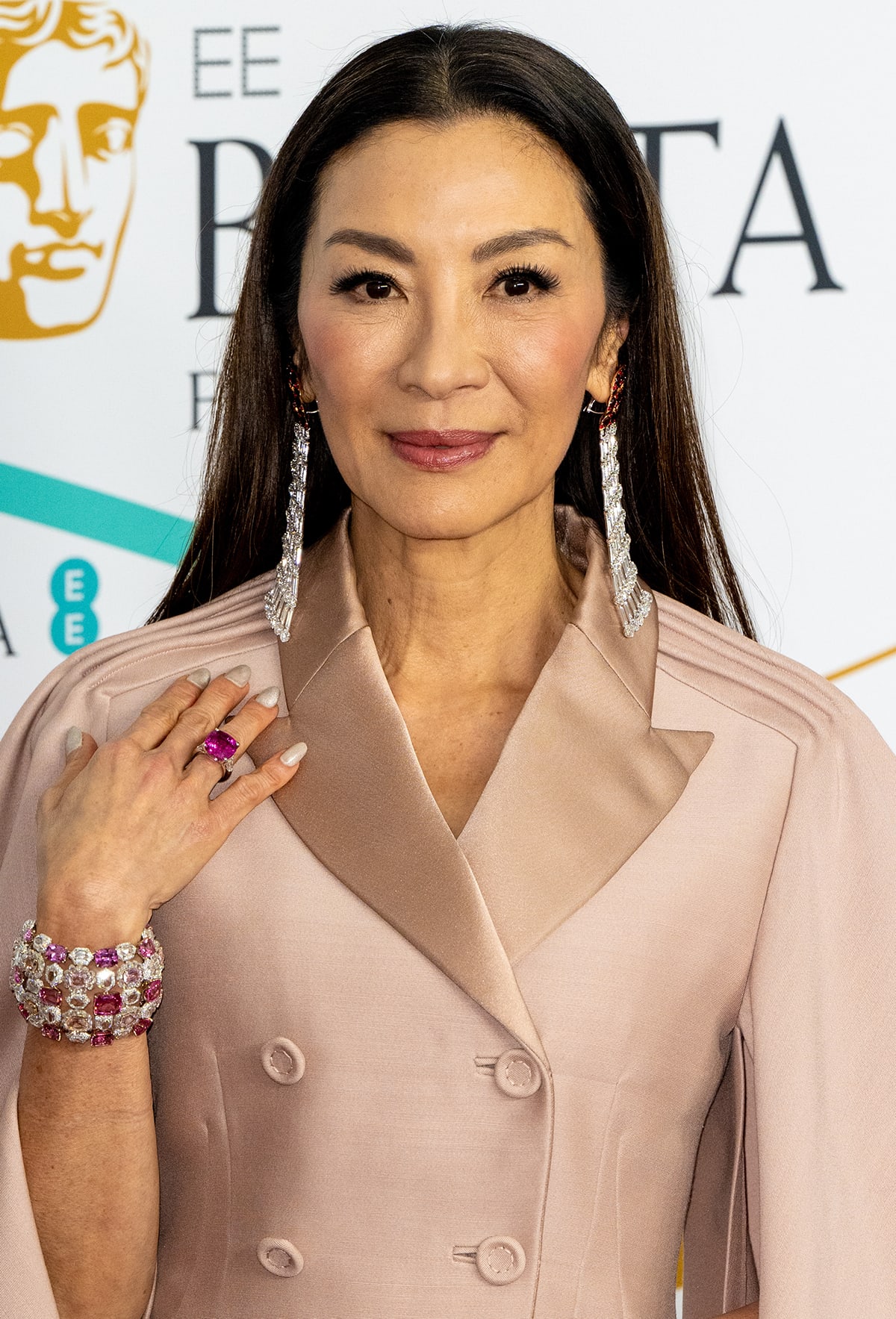 Michelle Yeoh keeps things classy with Moussaieff jewelry, straightened locks, and a radiant makeup