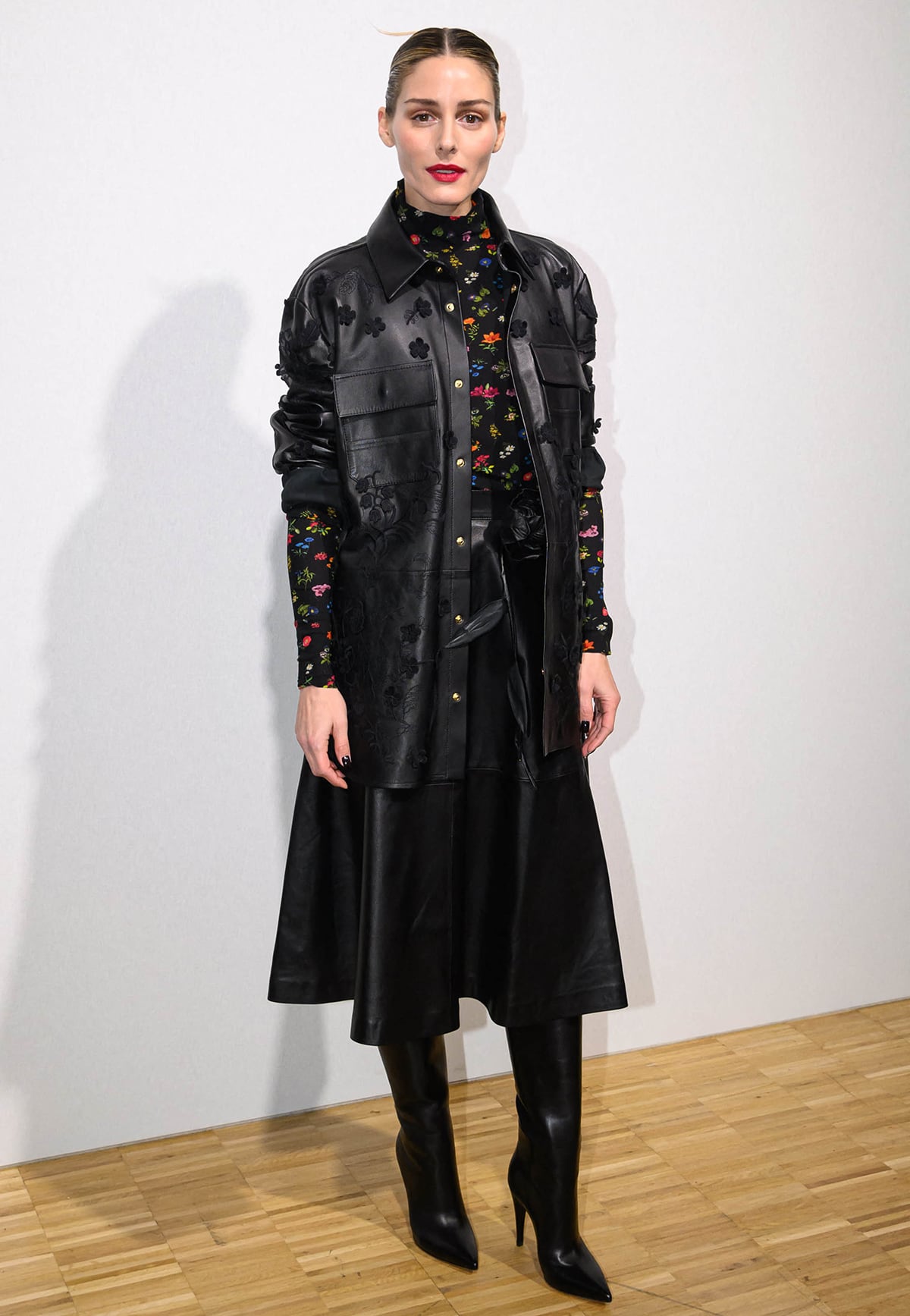 Olivia Palermo looks luxurious in an Elie Saab leather embroidered jacket and a leather midi skirt at the Lebanese fashion designer's runway presentation during Paris Fashion Week on January 25, 2023