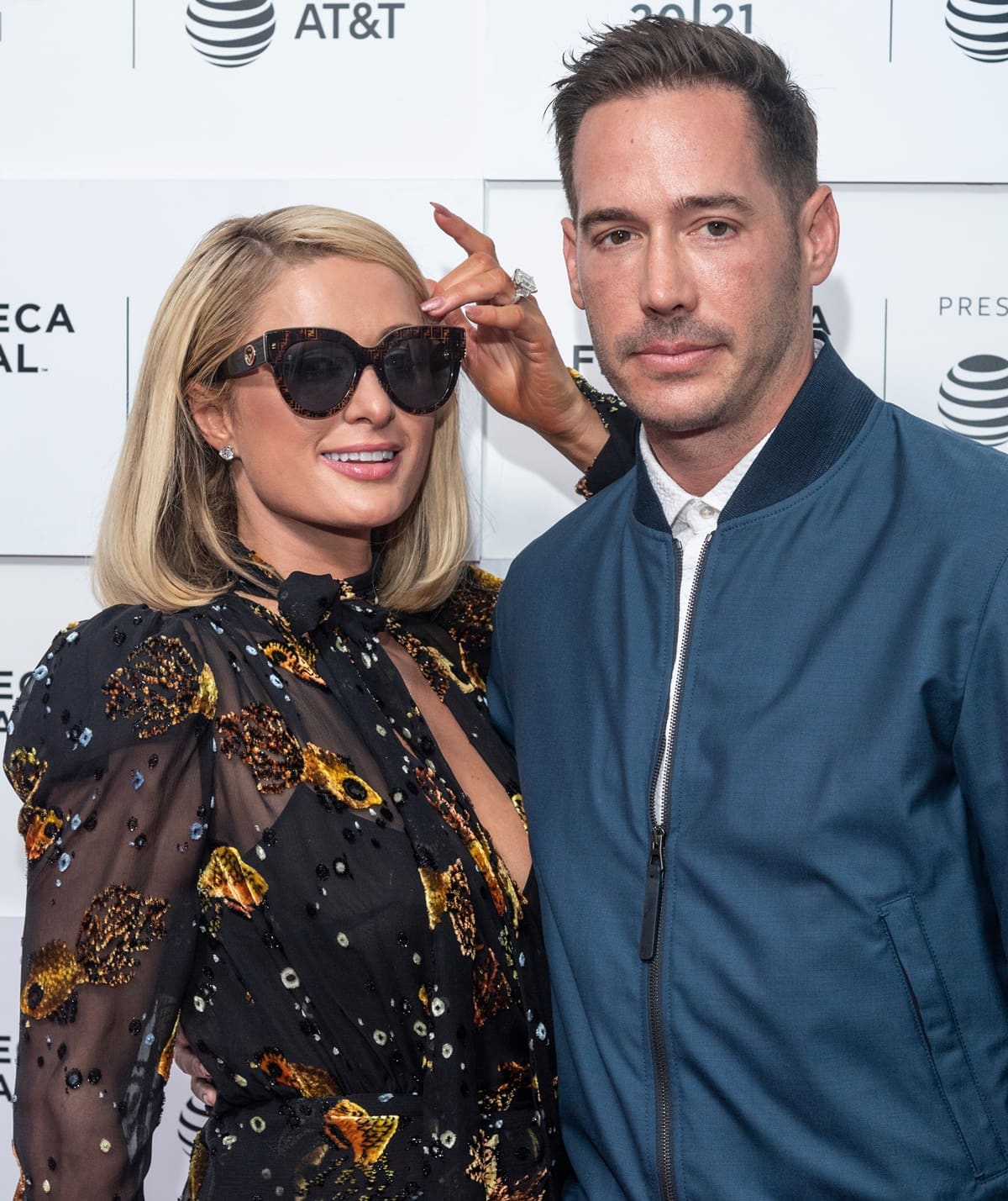 Paris Hilton and her husband, Carter Reum, welcomed their first child, a baby boy born via surrogate in January 2023; the couple named him Phoenix Barron Hilton Reum and have been open about their journey to parenthood after trying in vitro fertilization in 2021, with their romance starting in late 2019 and culminating in a luxurious wedding in November 2021