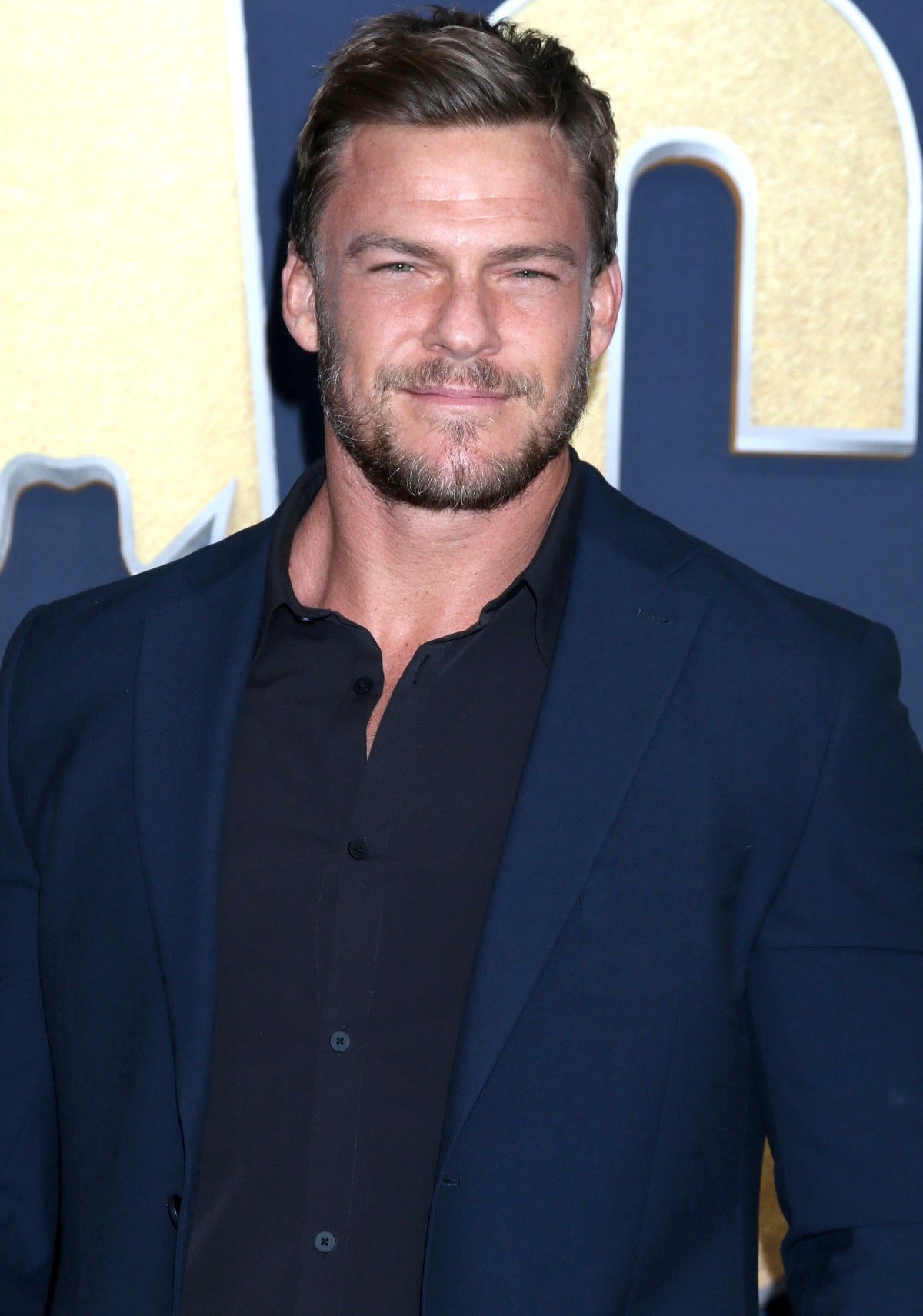Alan Ritchson attending the 2022 Academy of Country Music Awards