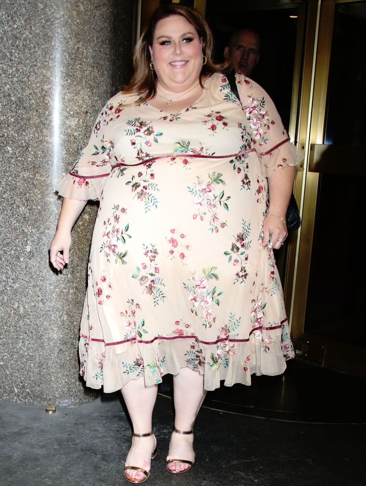 Chrissy Metz in a floral dress and ankle-strap heels on the set of New York Live