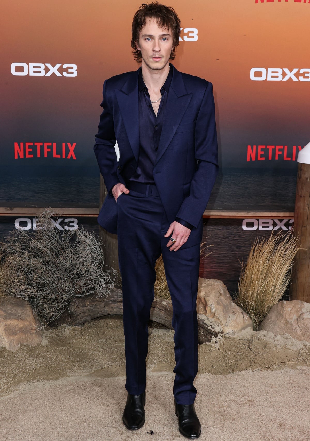 Drew Starkey donned a navy suit at the premiere of Netflix’s Outer Banks Season 3