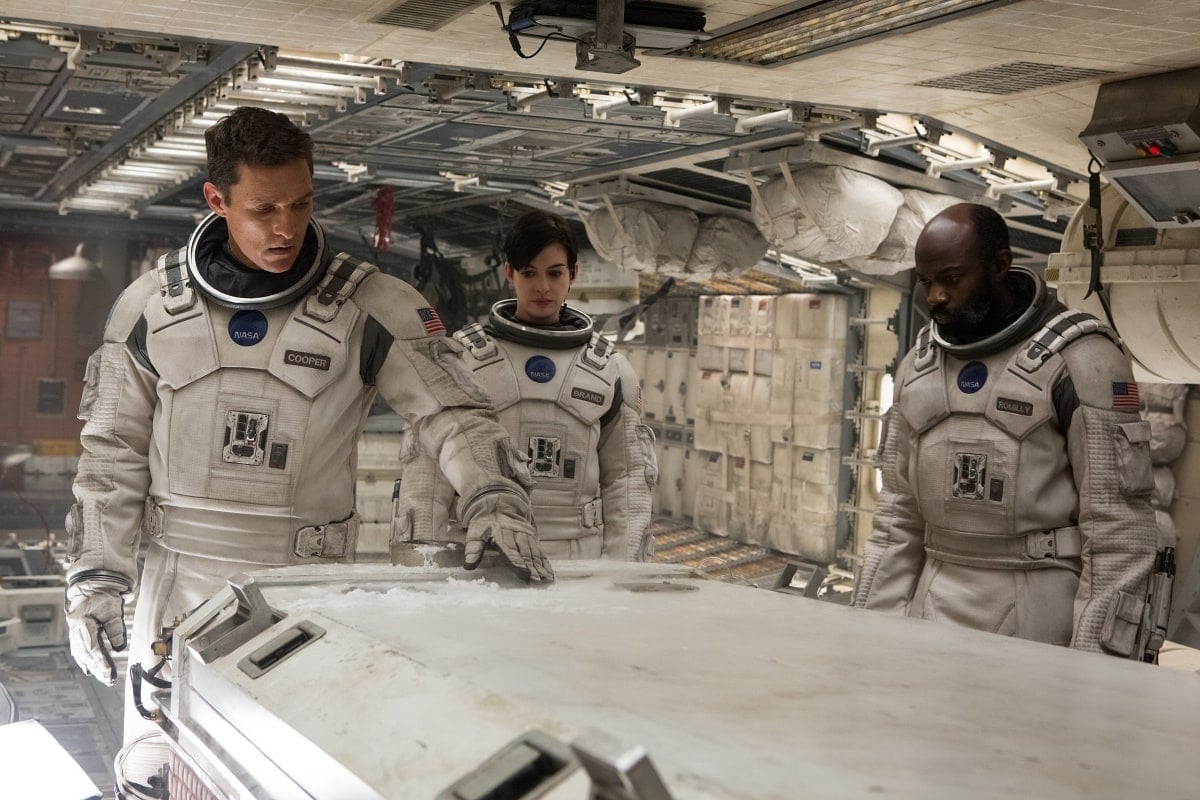 Matthew McConaughey as Joseph Cooper, Anne Hathaway as Dr. Amelia Brand, and David Gyasi as Dr. Romilly in the 2014 epic science fiction film Interstellar