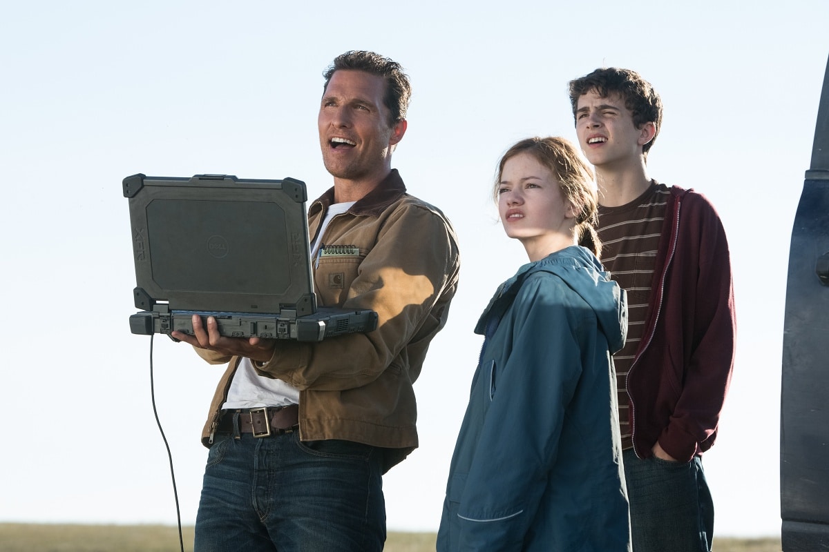 Matthew McConaughey as Joseph Cooper, Mackenzie Foy as Young Murph Cooper, and Timothee Chalamet as Young Tom Cooper in the 2014 epic science fiction film Interstellar