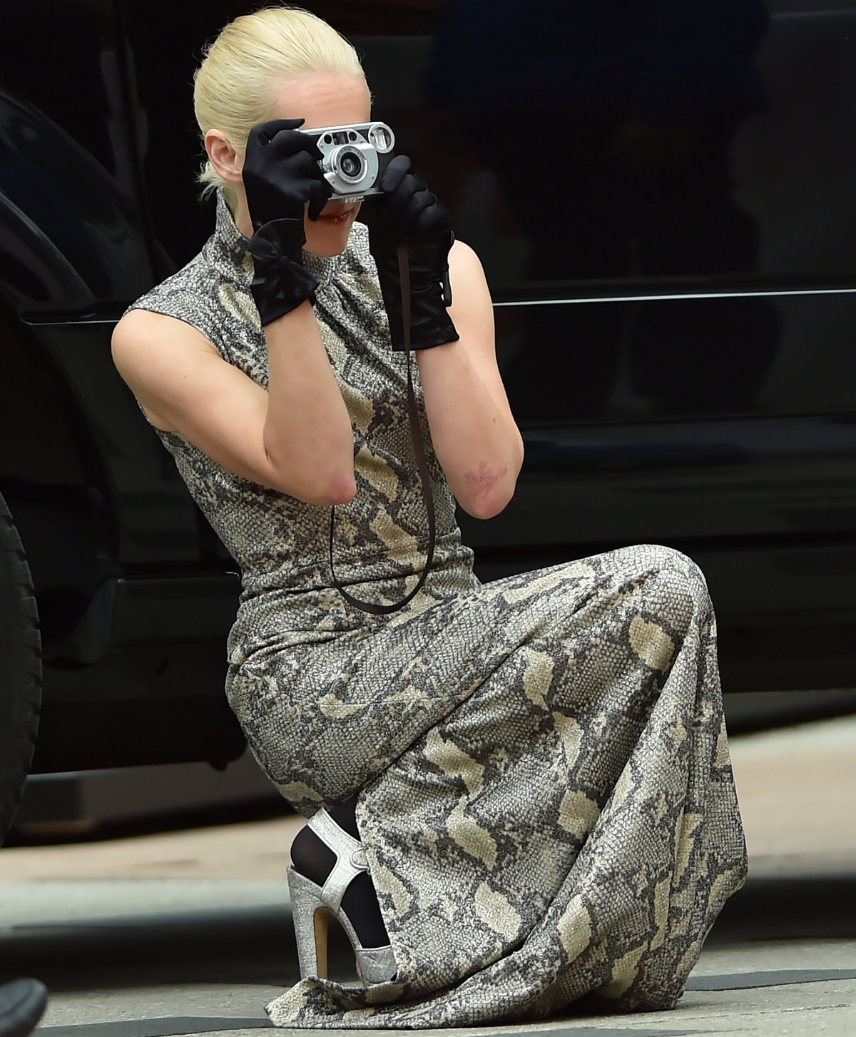 Jena Malone taking photographs during the 2018 Toronto International Film Festival