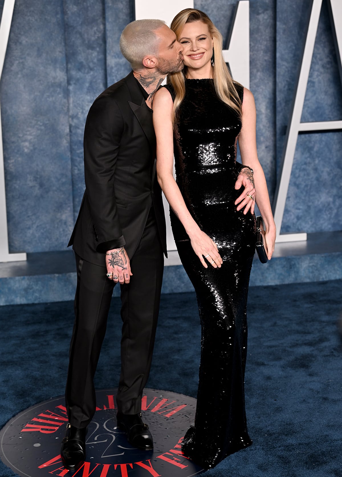 Adam Levine and Behati Prinsloo pack on the PDA in matching all-black outfits at the 2023 Vanity Fair Oscars After-Party on March 12, 2023