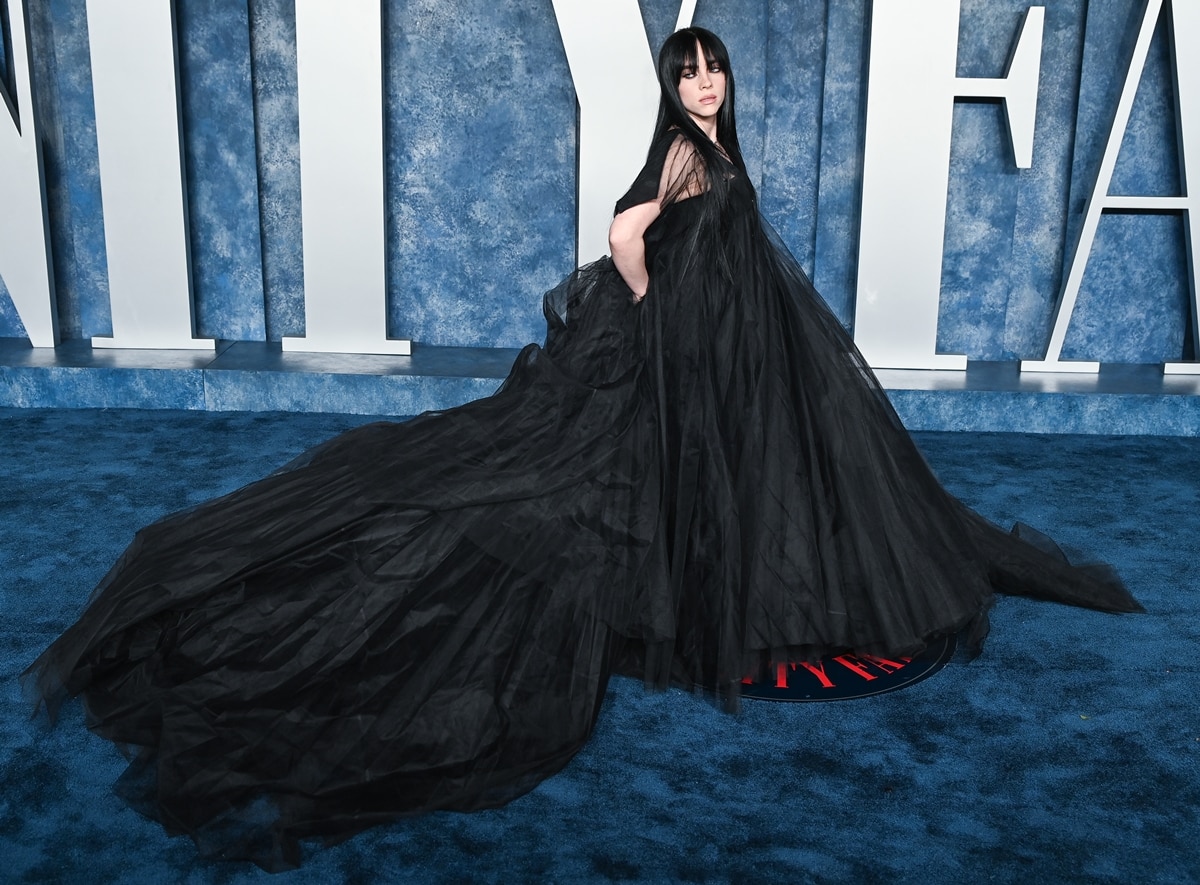 Billie Eilish donned a striking black Rick Owens gown that exuded gothic glamour and completed her ensemble with Chrome Hearts jewelry