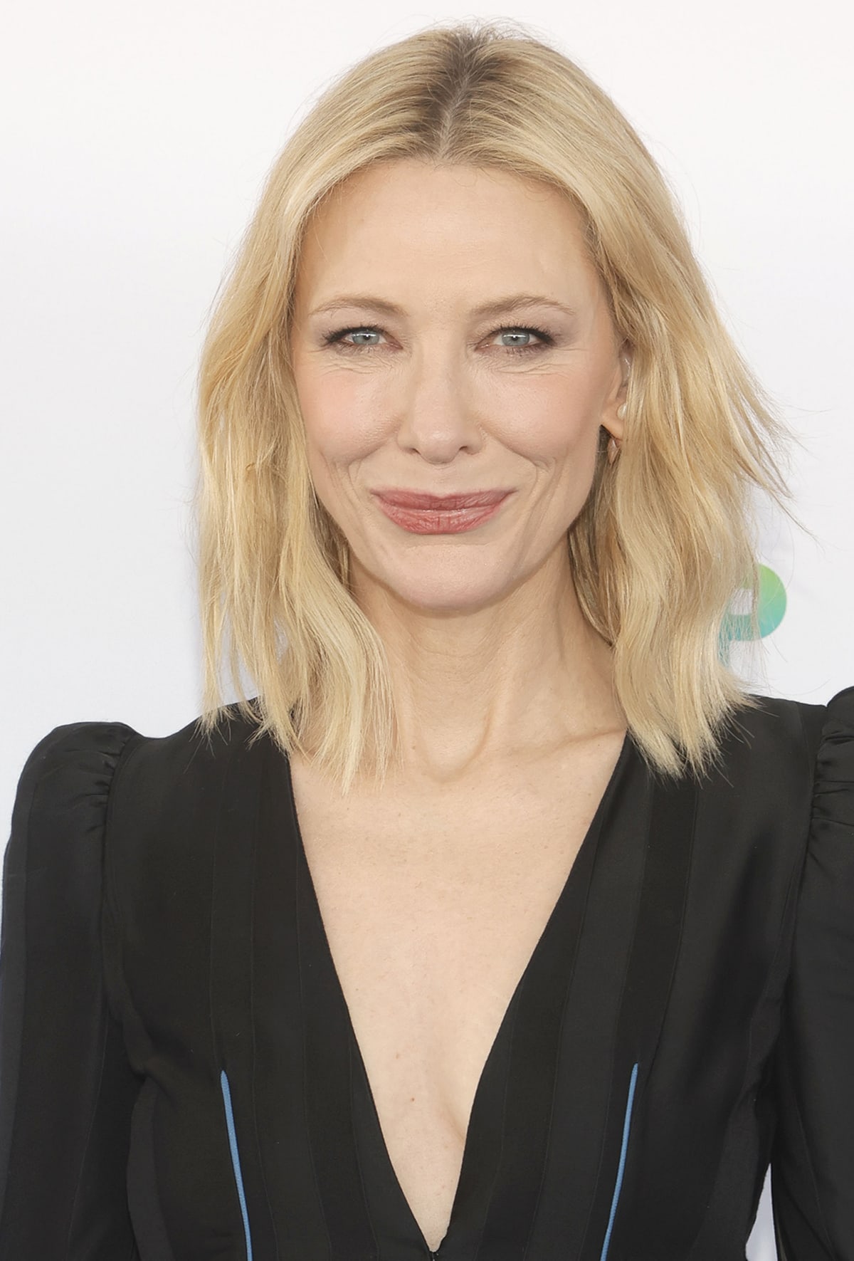 Cate Blanchett wears her blonde hair in loose waves and accentuates her features with Armani Beauty makeup