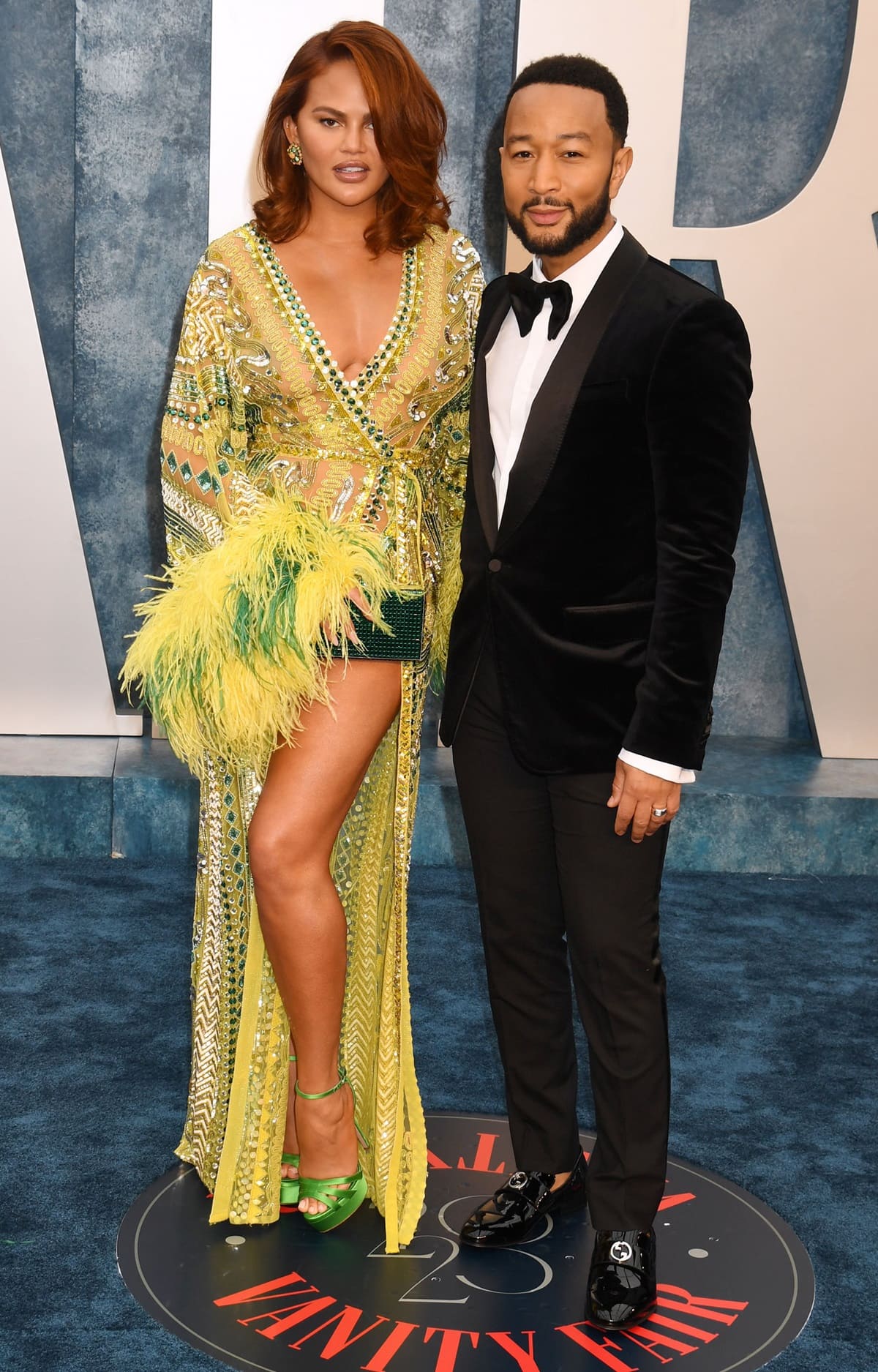 Chrissy Teigen and John Legend earning the title of "cool parents " at the Vanity Fair Oscar Party