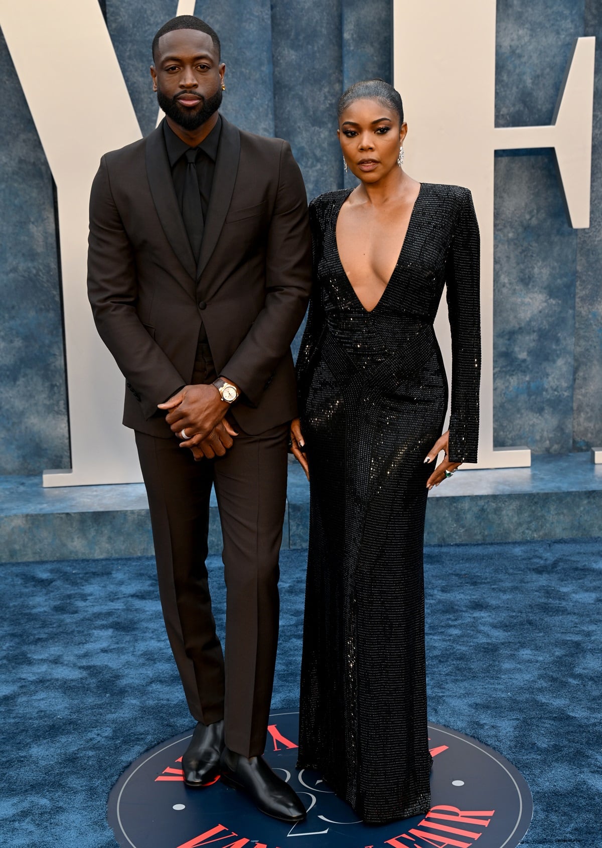 Gabrielle Union stunned in a Ralph Lauren gown while her husband Dwyane Wade donned an ensemble from Prada at the 2023 Vanity Fair Oscar Party