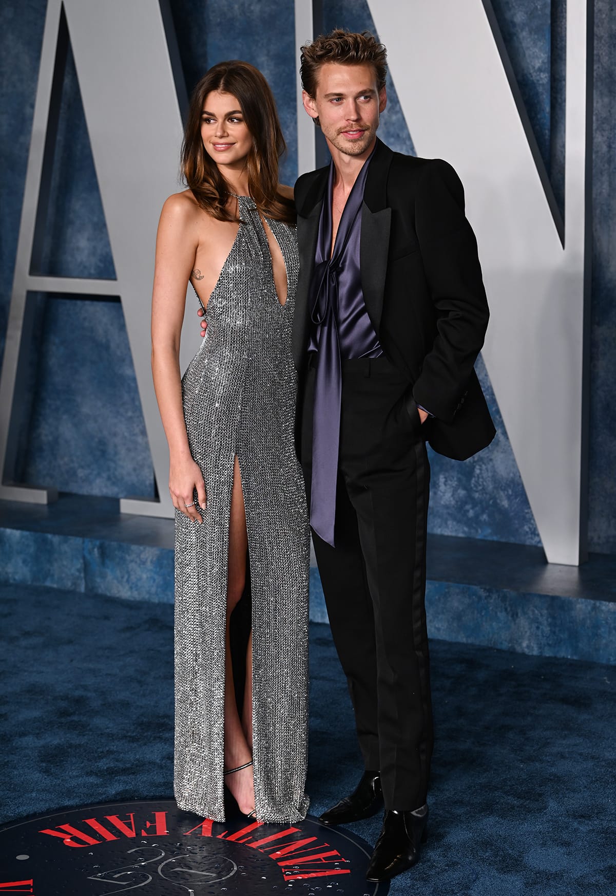 Kaia Gerber showcases her model figure in a slinky crystal-embellished gown by Celine