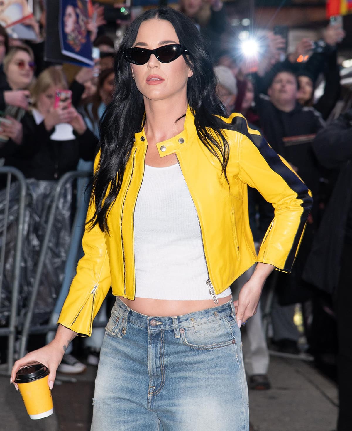 Katy Perry keeps the look cool with cat-eye sunglasses and loose waves hairstyle