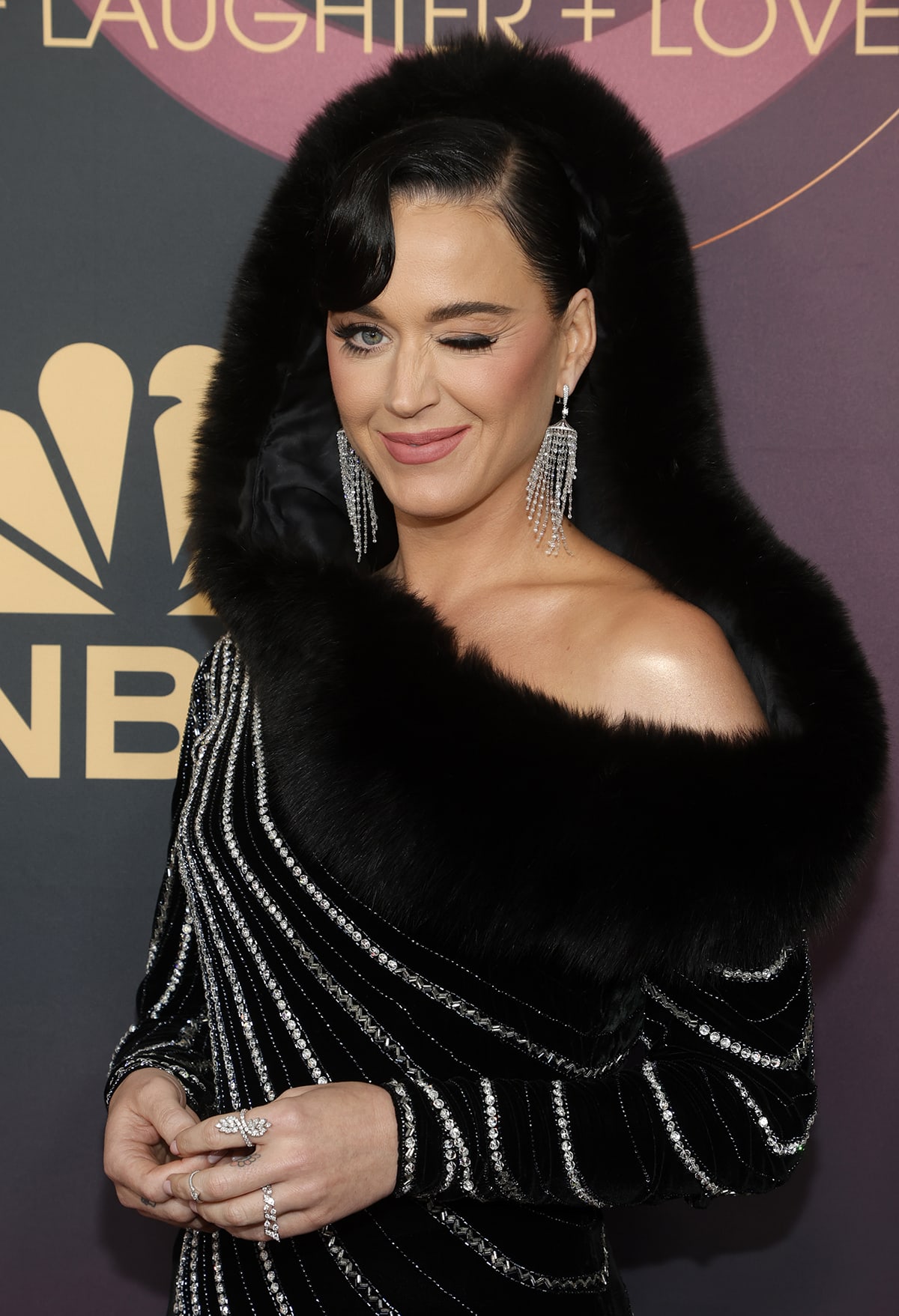 Katy Perry styles her look with Vera Belleza diamond chandelier earrings and a Marli diamond ring