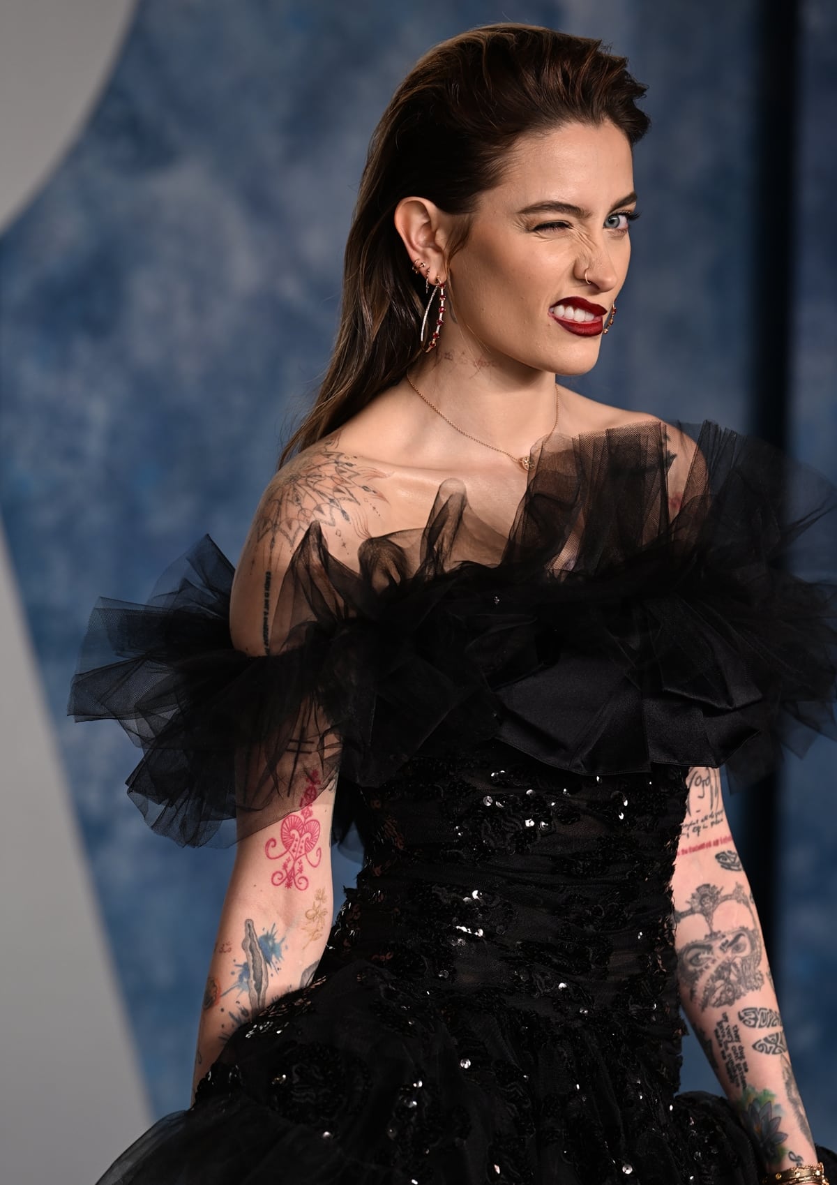 Paris Jackson rocks a sparkling black high-low dress with a statement ruffle neckline and a drop waist from Giambattista Valli couture