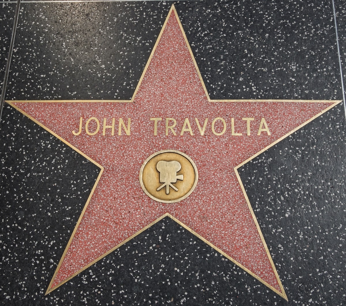John Travolta received a star on the Hollywood Walk of Fame in 1985, recognizing his contributions to the entertainment industry, particularly in motion pictures