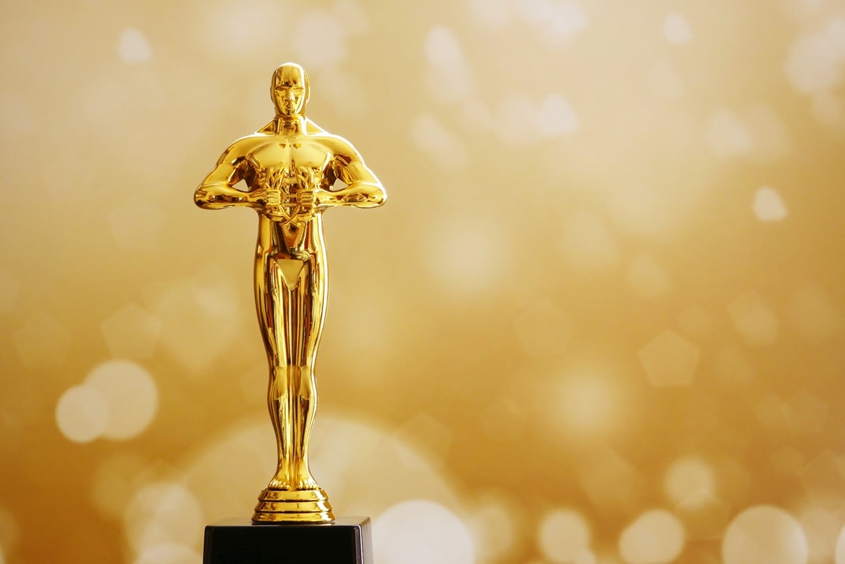 The Oscar statuette is made of gold-plated bronze and stands 13.5 inches tall, weighs around 8.5 pounds and depicts a knight holding a crusader's sword, standing on a reel of film