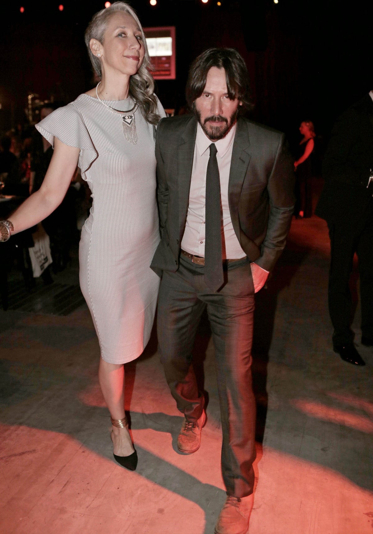 Alexandra Grant and Keanu Reeves having fun at the UNAIDS Gala during Art Basel 2016