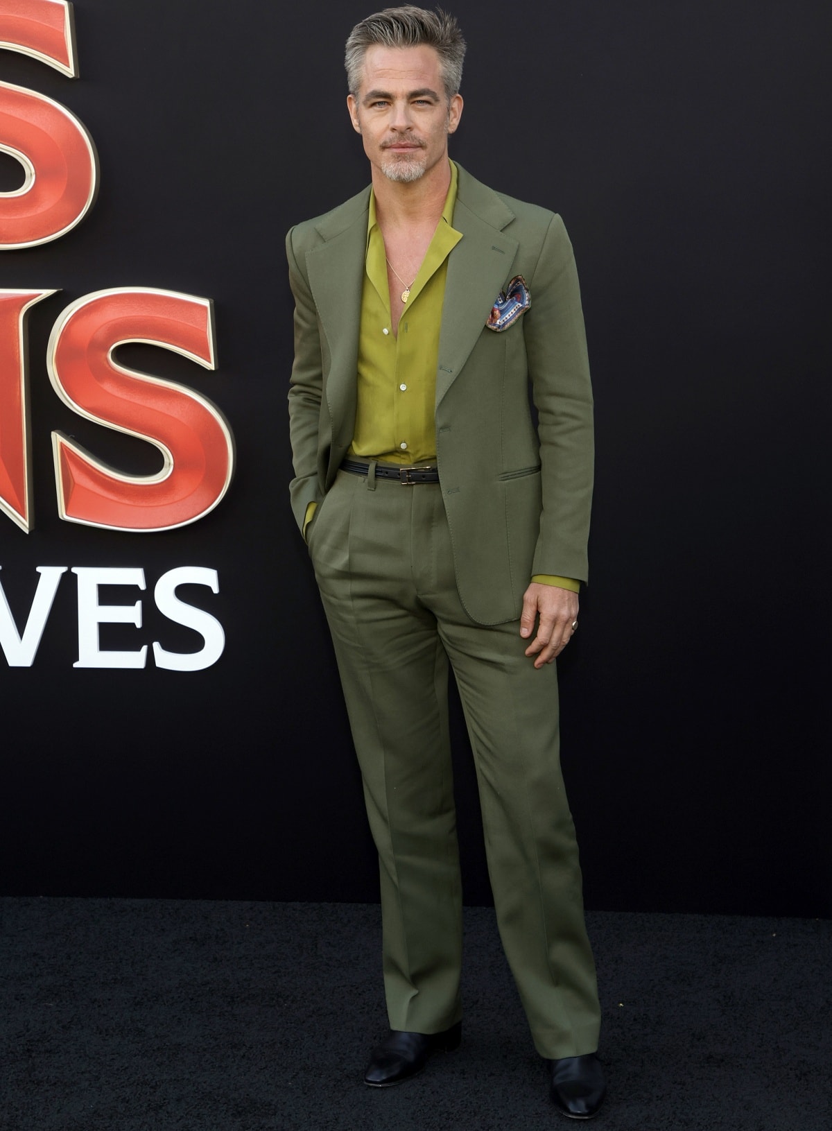 Chris Pine looked handsome in his dark green suit at the premiere of Dungeons & Dragons: Honor Among Thieves