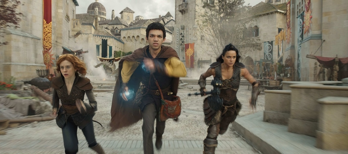 Justice Smith as Simon Aumar with co-stars Sophia Lillis as Doric and Michelle Rodriguez as Holga Kilgore in the 2023 fantasy heist action-comedy film Dungeons & Dragons: Honor Among Thieves