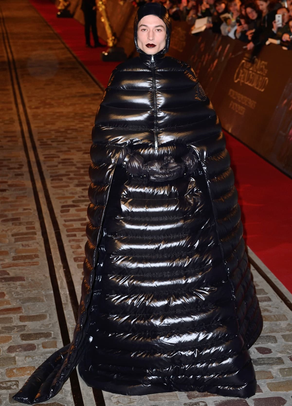 Ezra Miller wearing a black inflatable outfit at the Fantastic Beasts: The Crimes of Grindelwald premiere