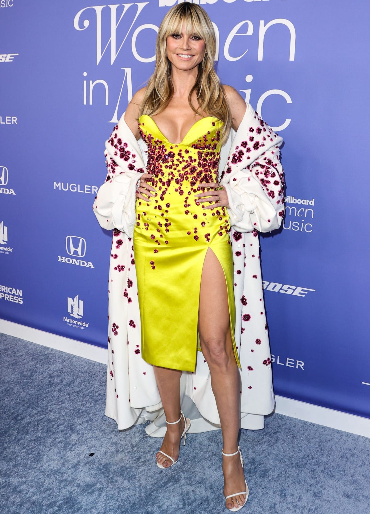 Heidi Klum wearing a yellow Miss Sohee Spring 2023 gown at the 2023 Billboard Women in Music Awards