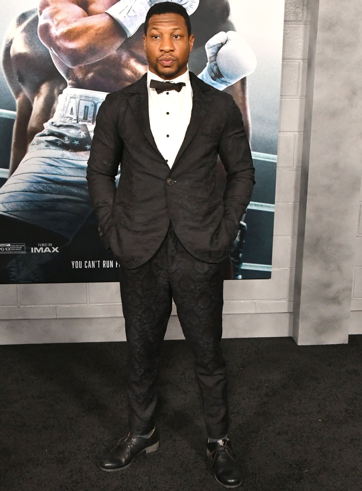 Jonathan Majors stepped out in a patterned black suit at the Los Angeles premiere of Creed III
