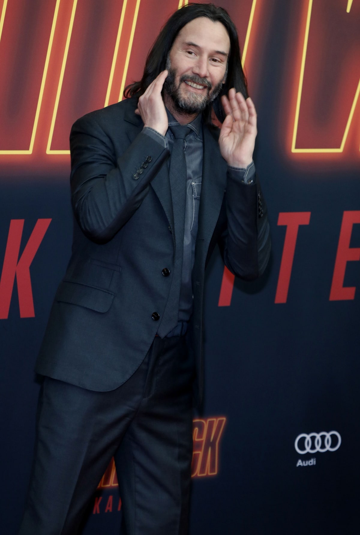 Keanu Reeves greeting fans at the premiere of John Wick: Chapter 4 in Berlin