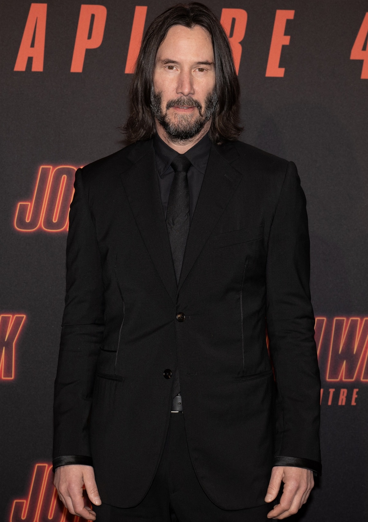 Keanu Reeves arriving in head-to-toe black at the premiere of John Wick: Chapter 4 held at Le Grand Rex in Paris