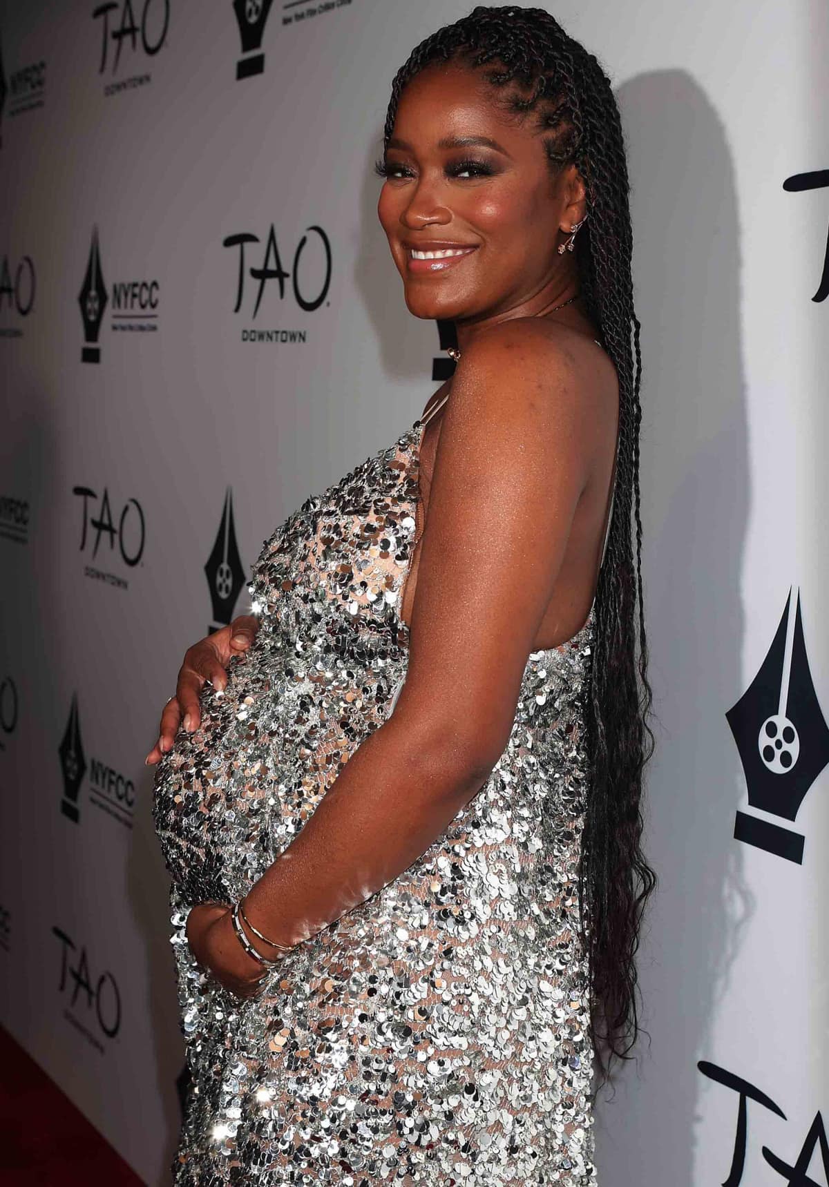 Keke Palmer showcasing her baby bump in a Michael Kors silver sequined gown at the New York Film Critics Circle Awards