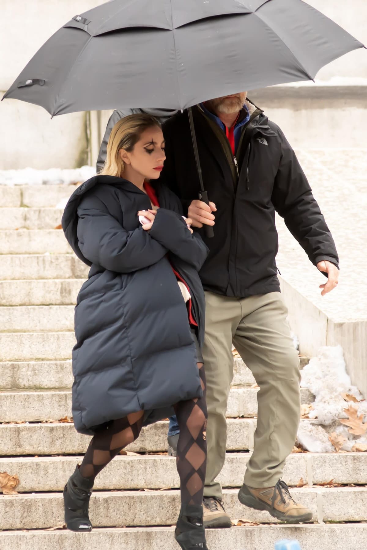 Lady Gaga kept herself warm with a dark blue jacket after filming wrapped for the day
