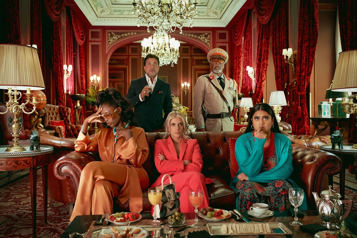 The supporting cast of Murder Mystery 2 brings vibrant personalities to life in this lavish and suspense-filled scene, set in an opulent mansion