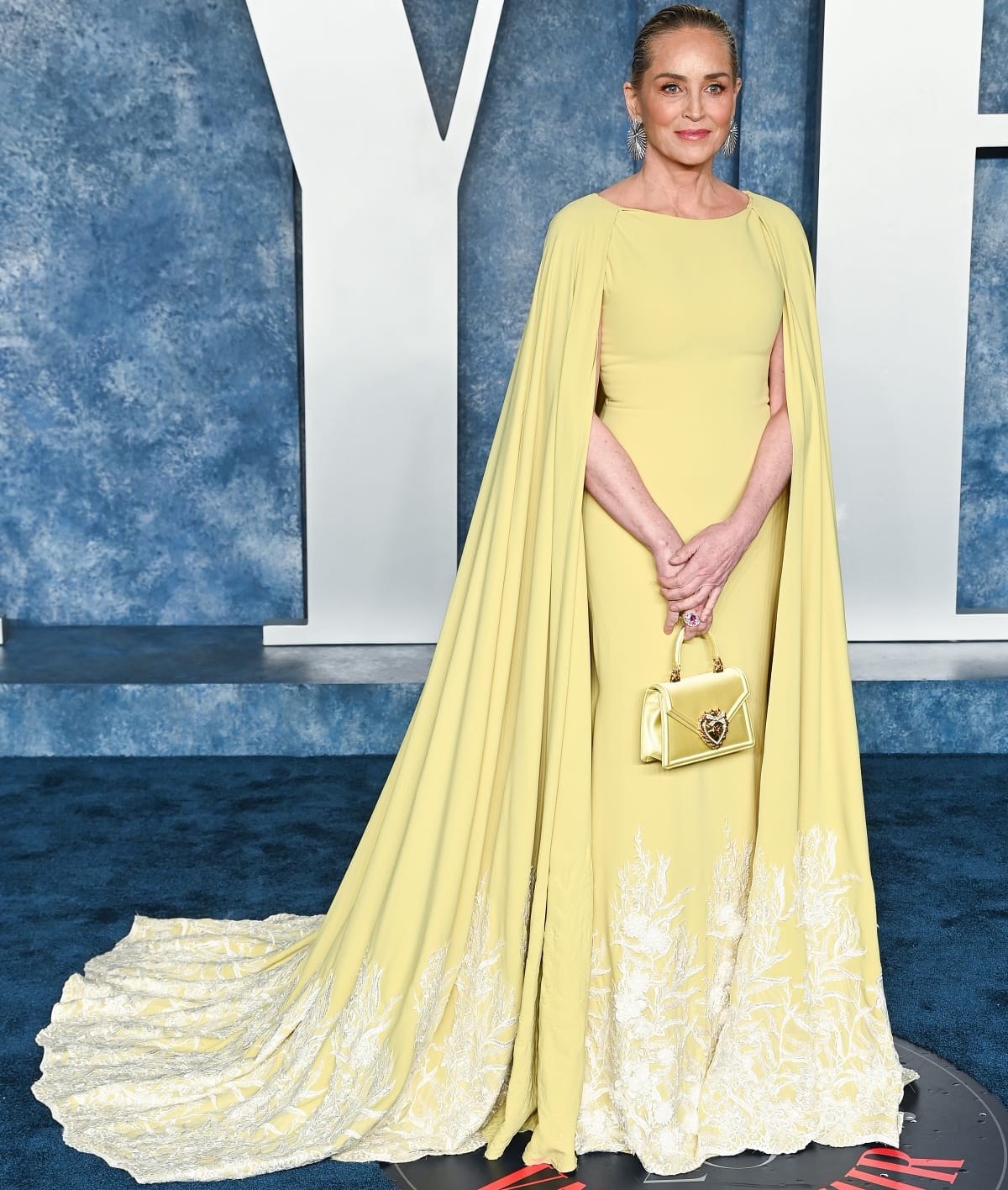 Sharon Stone looked every bit the movie star in her radiant yellow Tony Ward Fall 2017 Couture archive gown with a matching Dolce & Gabbana bag and Giorgio B jewelry at the 2023 Vanity Fair Oscar Party