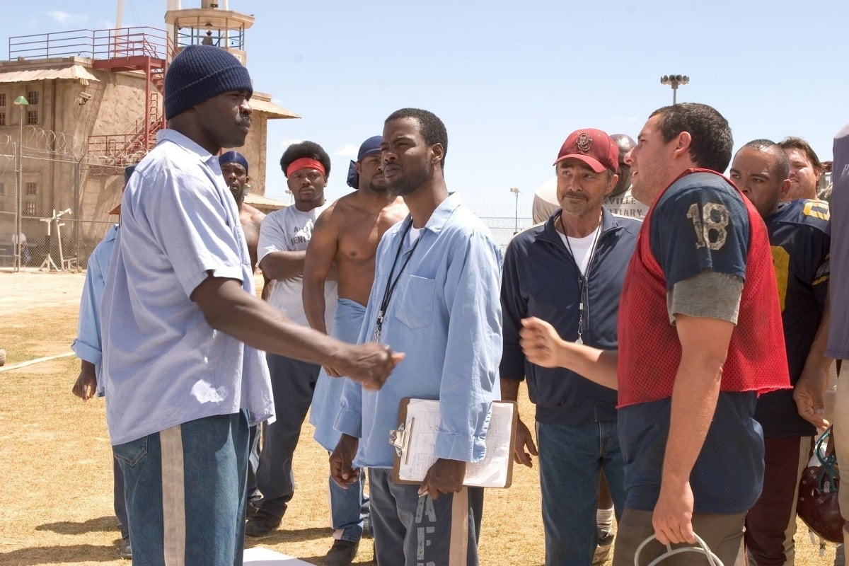 Adam Sandler as Paul Crewe and Chris Rock as Caretaker assembling their football team in The Longest Yard