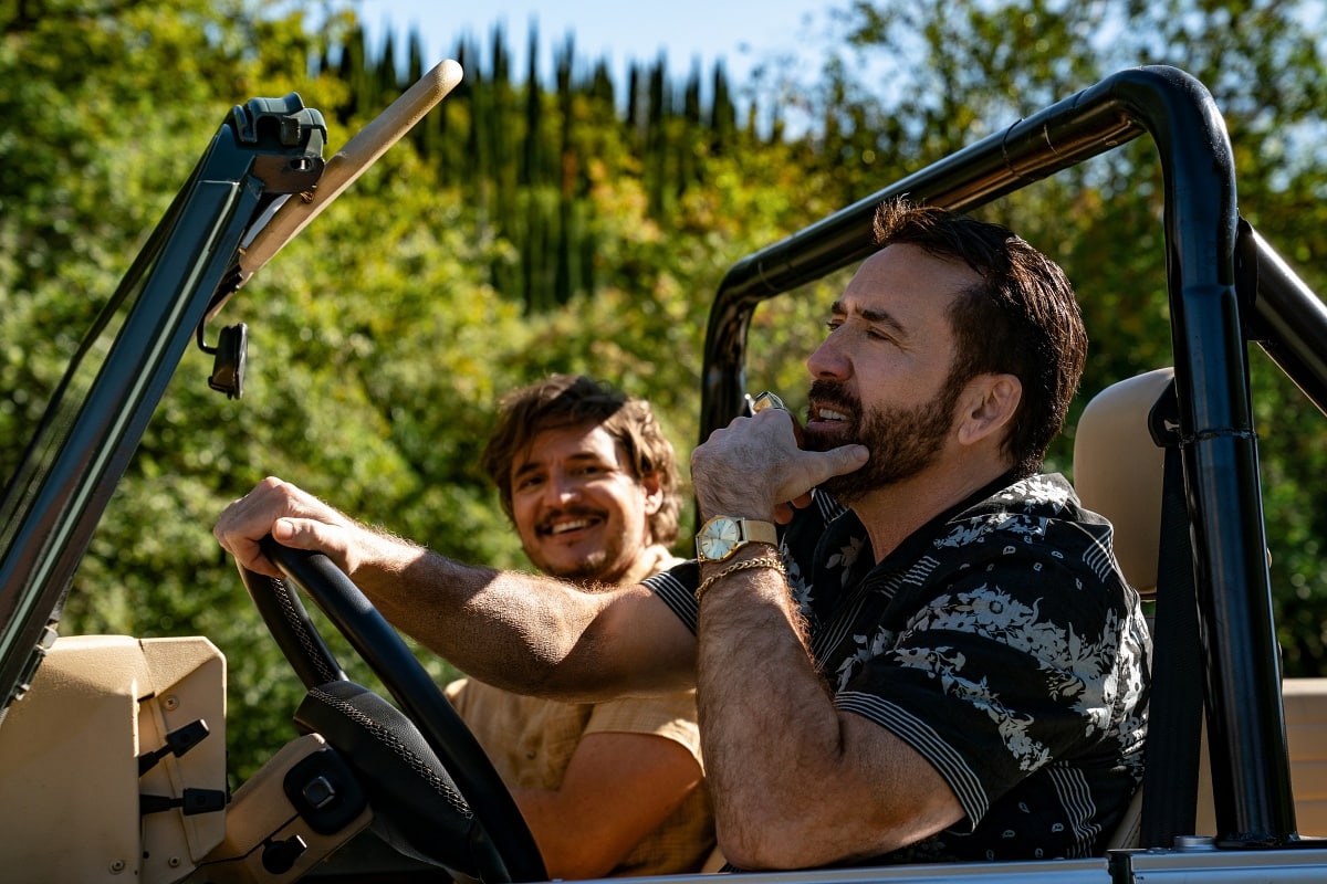 Nicolas Cage as Nick Cage and Pedro Pascal as Javi Gutierrez in the 2022 action-comedy film The Unbearable Weight of Massive Talent