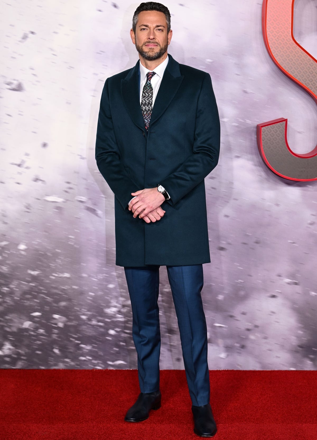 Zachary Levi stepped out in a Paul Smith suit with Christian Louboutin shoes at the UK premiere of Shazam! Fury of the Gods