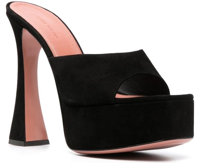 The Dalida mules by Amina Muaddi have thick platforms and sculpted high heels