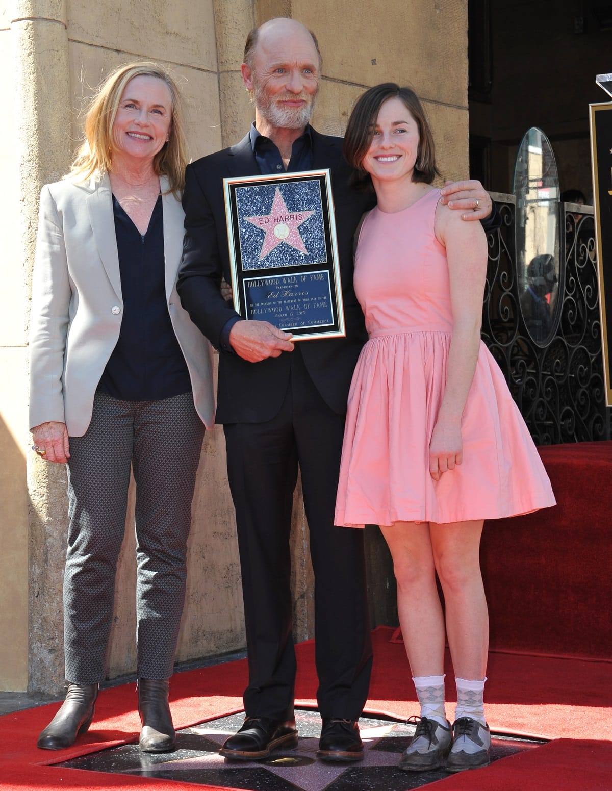Actress Amy Madigan, who played Chanice Kobolowski, the girlfriend of Uncle Buck and proprietor of a tire shop, with her husband Ed Harris and her daughter Lily at the Ed Harris Star ceremony
