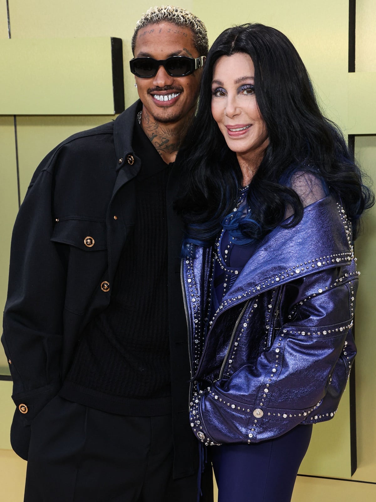 Cher with her boyfriend Alexander "A.E." Edwards, a music producer and Def Jam A&R executive who is 40 years her junior, at the Versace FW23 Show