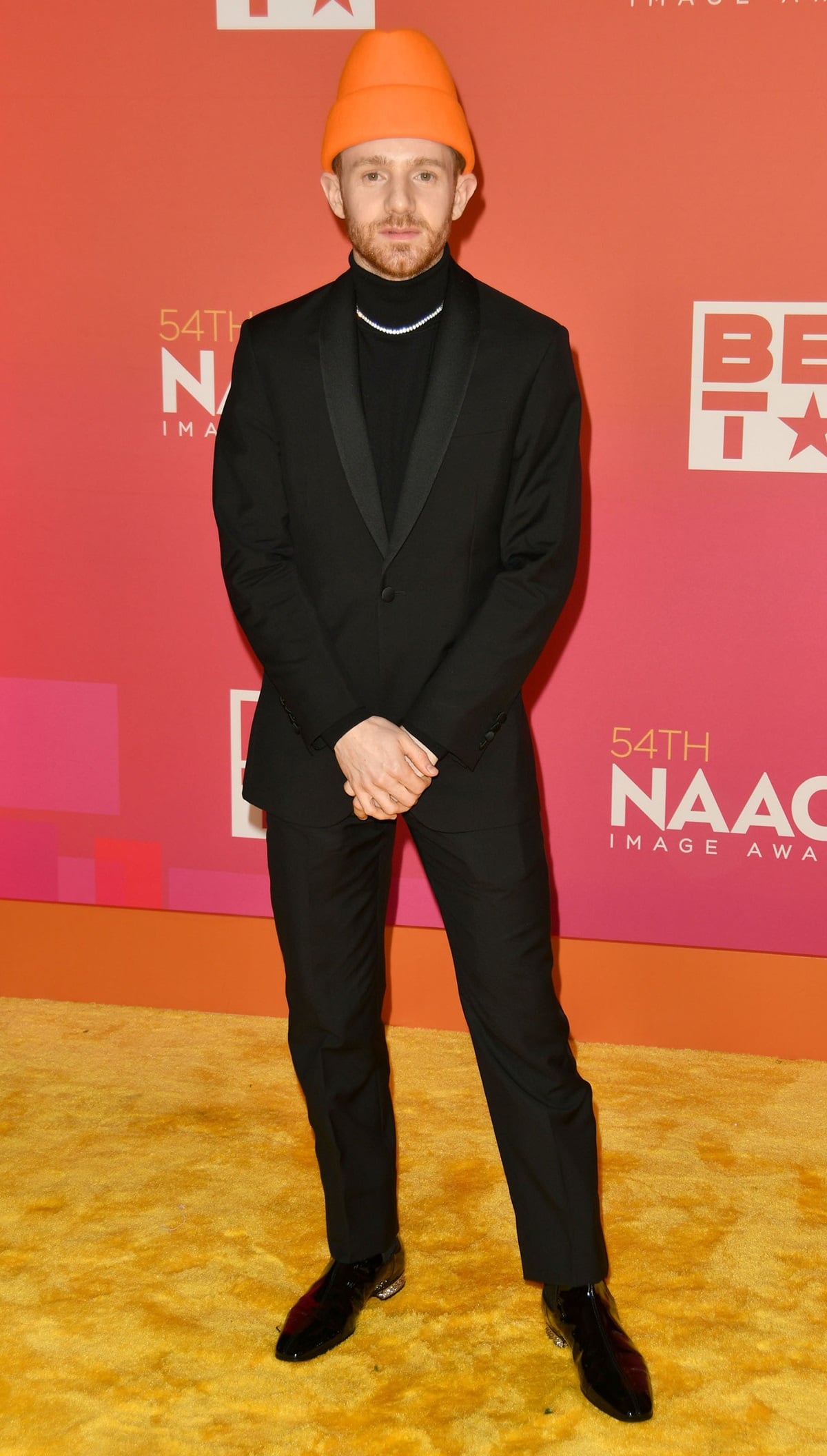 Chris Perfetti wears a Richard James suit paired with a Paul Smith turtleneck and Christian Louboutin shoes at the 54th annual NAACP Image Awards
