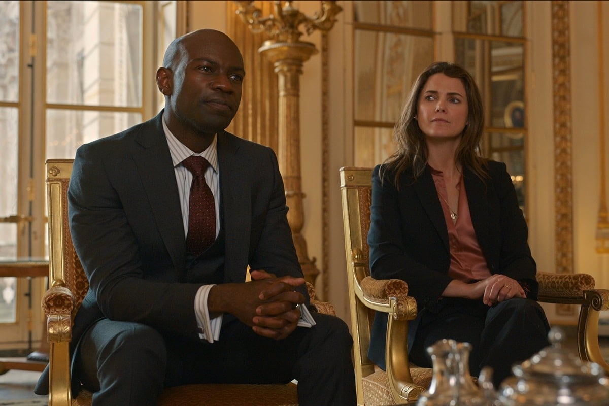 David Gyasi portrays British Foreign Secretary Austin Dennison and Keri Russell portrays the new United States ambassador to the United Kingdom in the TV series The Diplomat